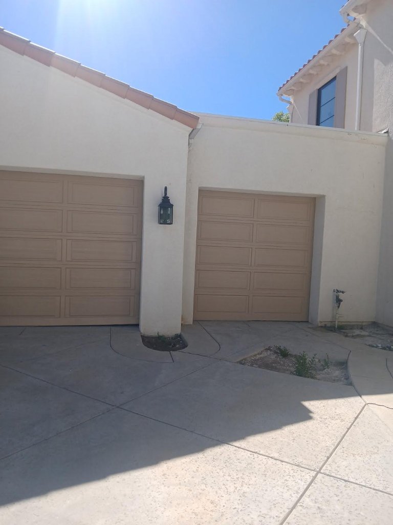 Beige garage doors before exterior painting Los Angeles