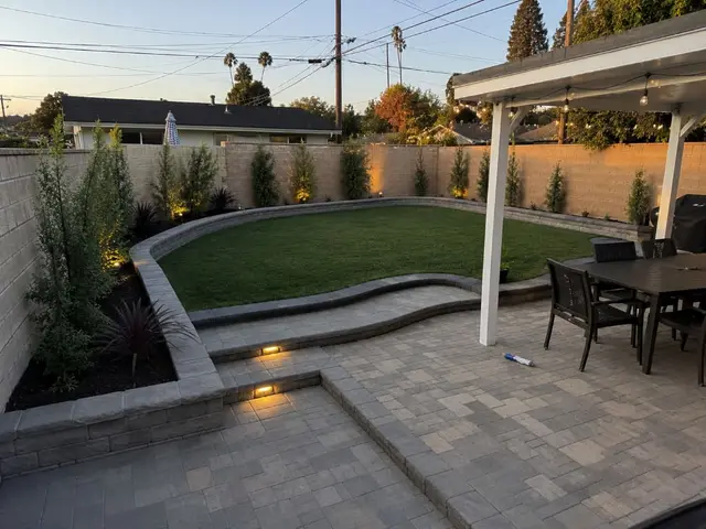 Backyard paver patio with fire pit and retaining wall Los Angeles