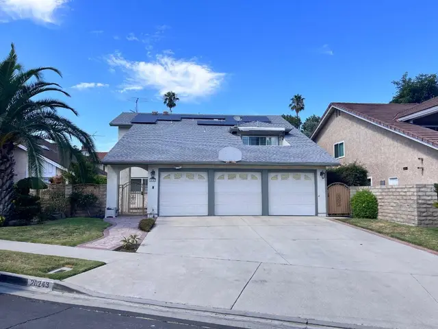 Residential street-view home with solar panels Los Angeles