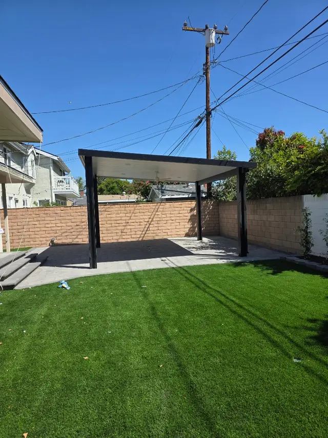 Modern pergola with paver patio and turf backyard Los Angeles