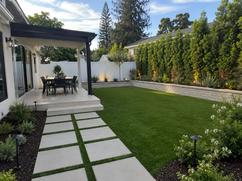 Modern backyard landscaping with pergola and lawn Los Angeles