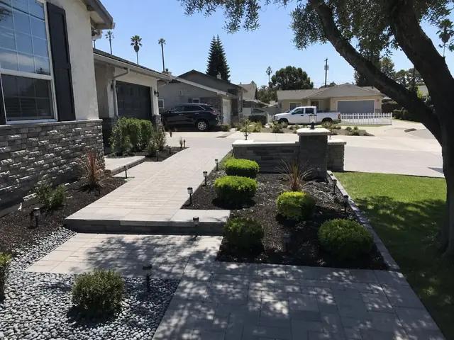 Front yard paver walkway with stone columns California