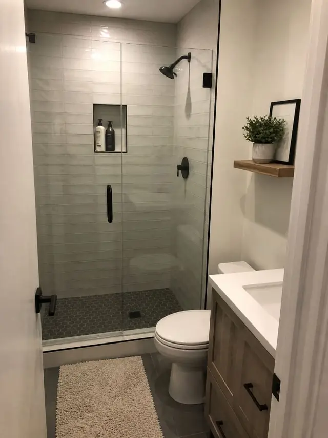 Small bathroom remodel with glass shower and modern vanity
