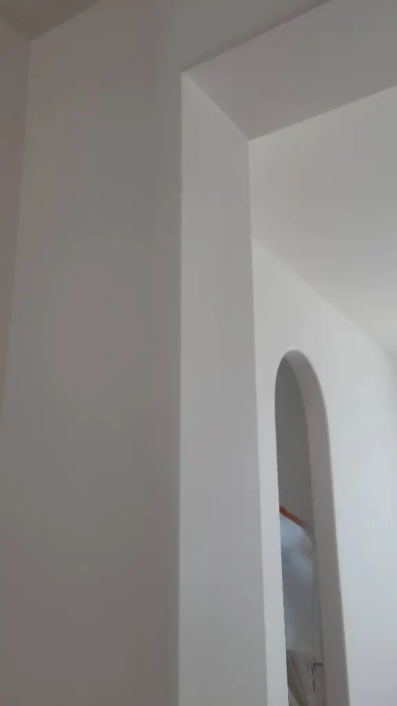 Clean white walls and arched niche interior painting California