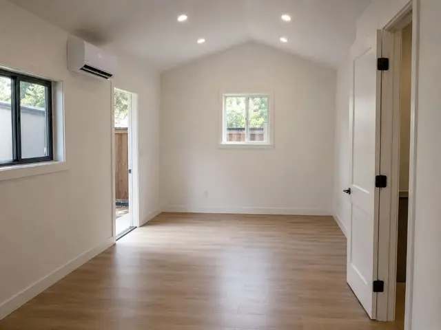 Bright ADU bedroom interior with vaulted ceiling and mini-split California