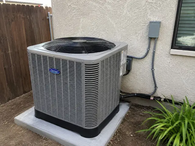 Carrier outdoor AC condenser unit installed on concrete pad California