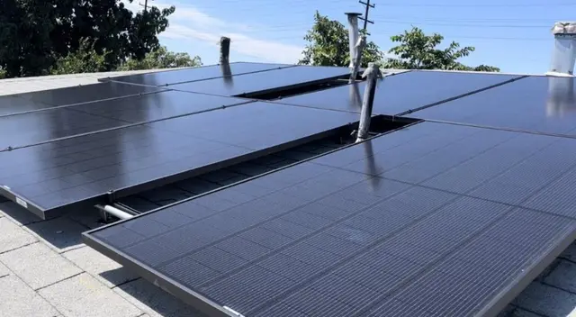 Flat roof solar panel installation close-up California
